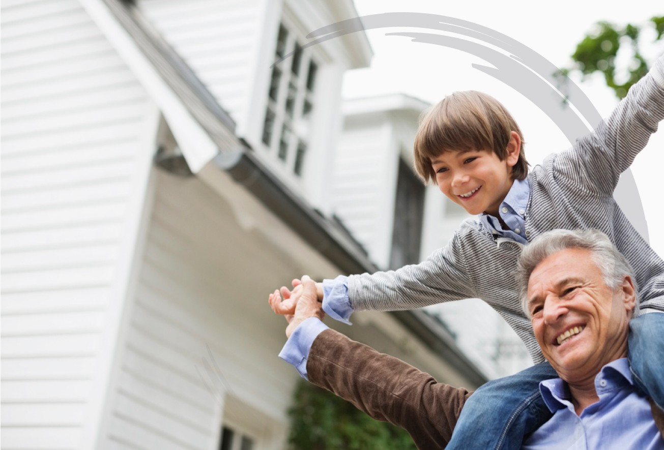 grandson sits on his grandfathers shoulders