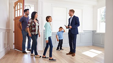 realtor welcomes family of 4 inside new house