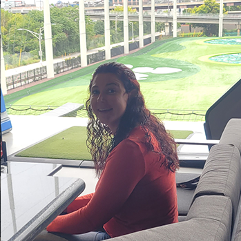 women sitting at top golf