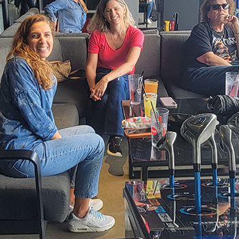 a woman sitting at top golf